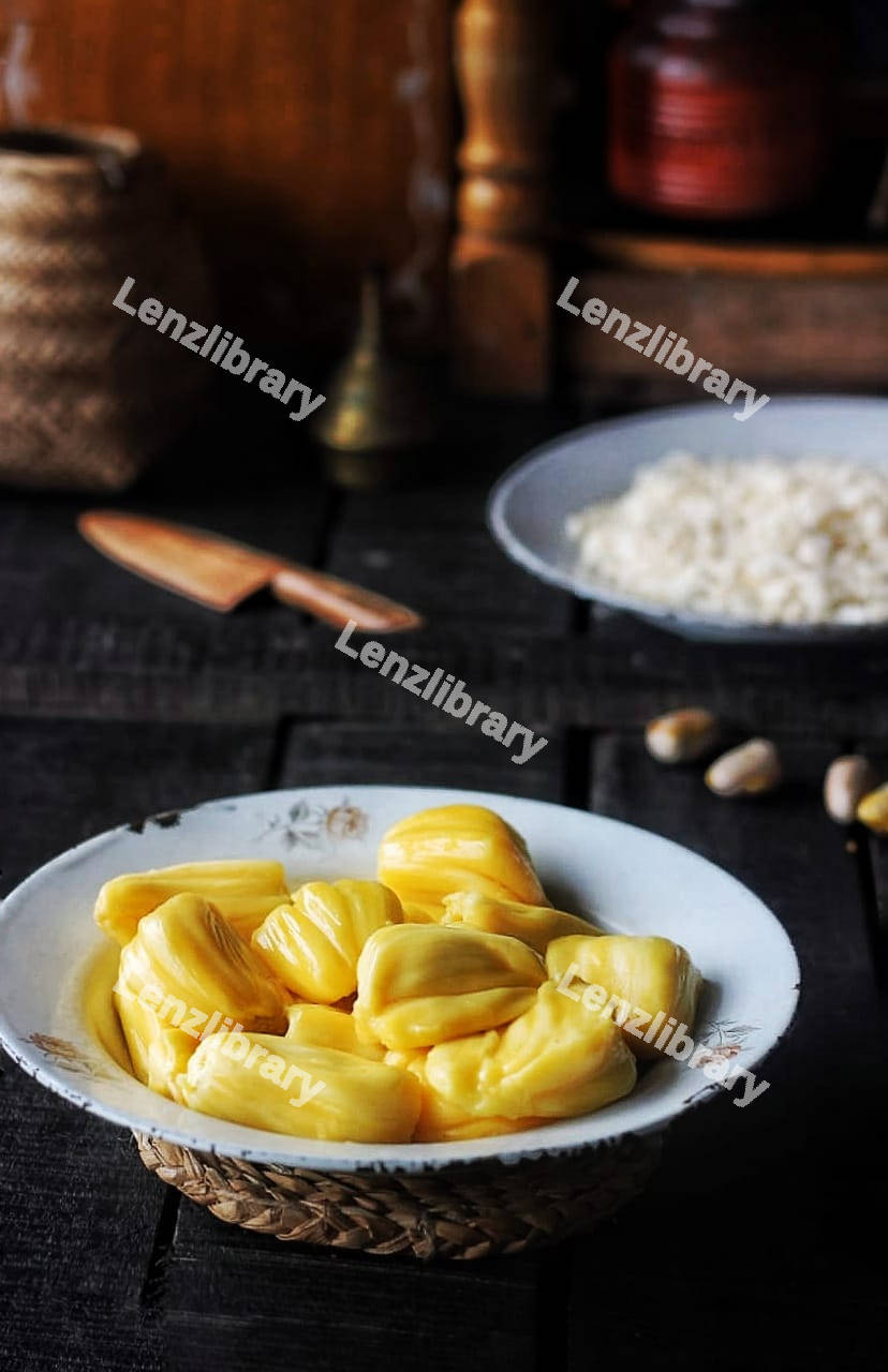 Fresh jackfruit slices on a white plate